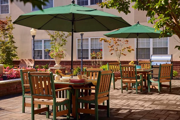 Outdoor seating area with umbrellas and flowers