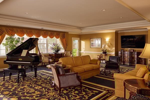 Elegant common area with seating and piano