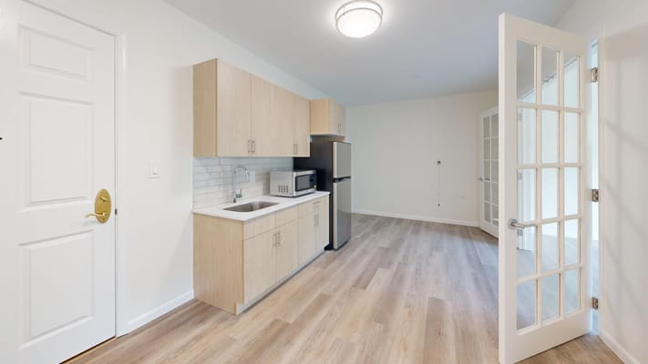 Bright, modern kitchen area in a resident room