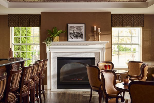Cozy common area with a fireplace and seating