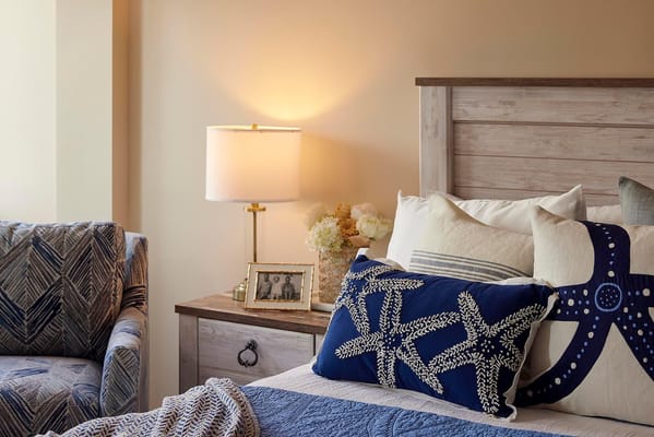 Cozy private resident room with comfortable furnishings.