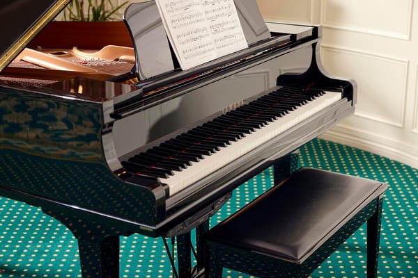 Close-up of a grand piano in a decorative setting