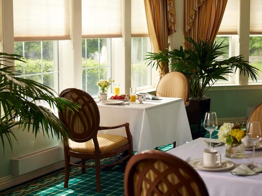 Dining area set for breakfast with a view