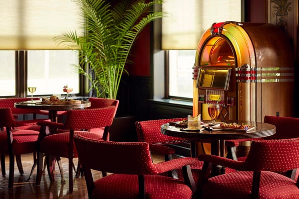 Interior view of a lounge with a vintage jukebox