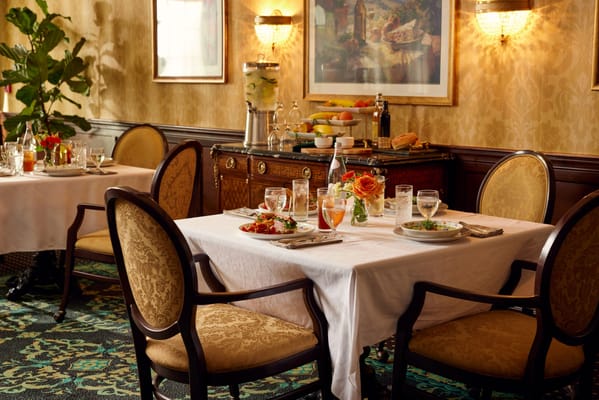 Elegant dining room table set with meals and decorations