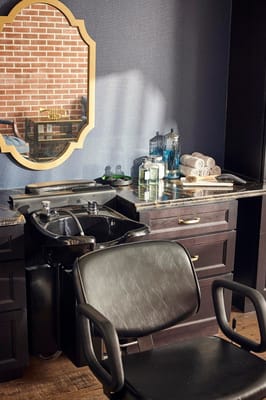 Salon area with a chair and sink