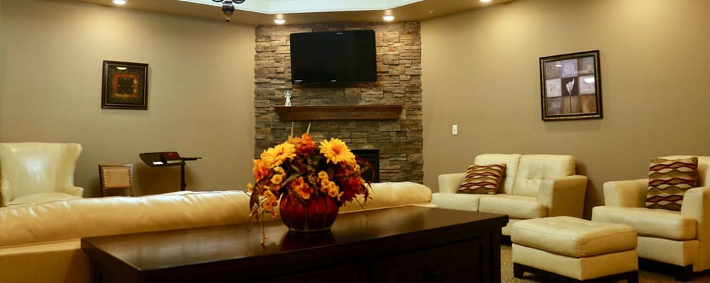 Cozy common area with seating and decorative flowers