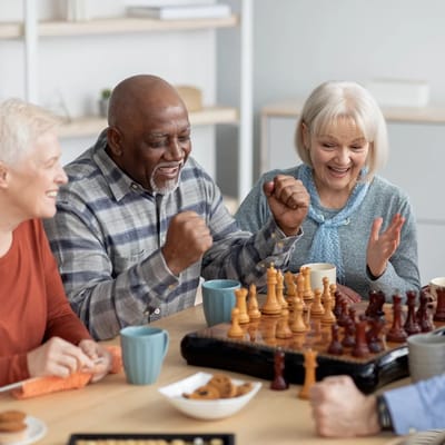 Residents enjoying a game of chess in a shared space