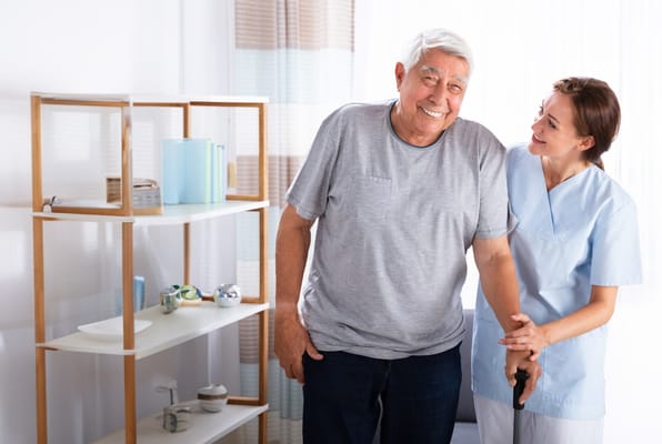 A cheerful interaction between a resident and staff member