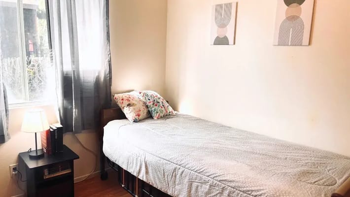 Cozy private room with a bed and decor