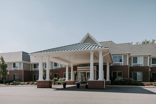 Front entrance of a senior living facility with columns