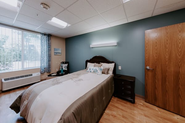 Cozy resident bedroom with a bed and decor