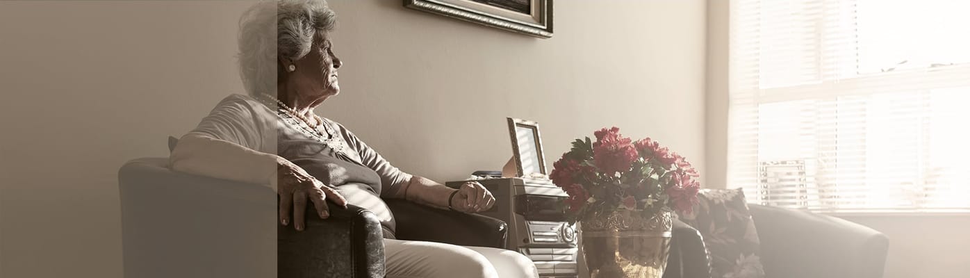 Senior resident enjoying time in a cozy living space