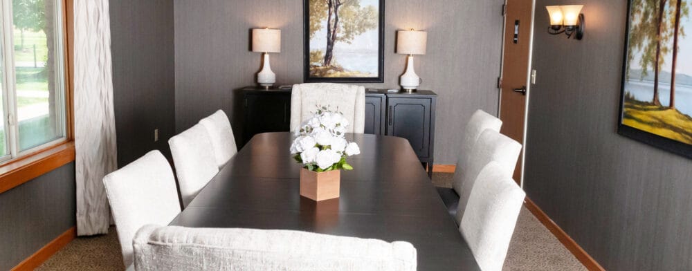 Modern dining area with a large table and decor