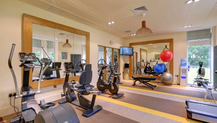 Well-equipped fitness room with exercise machines
