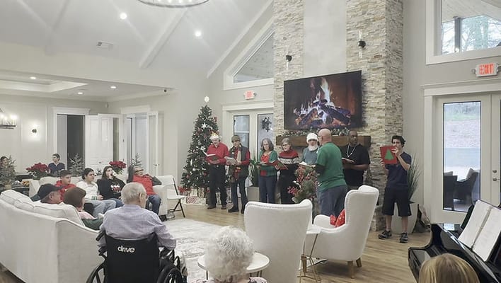 Residents and staff celebrating holiday together in common area