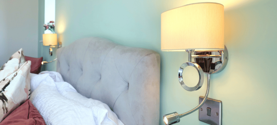 Cozy bedroom with modern lamp and decor