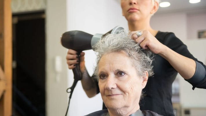 Resident getting a haircut in the salon