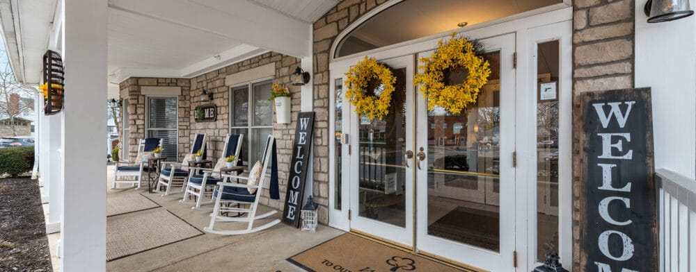 Welcoming entrance to a senior living facility with seating
