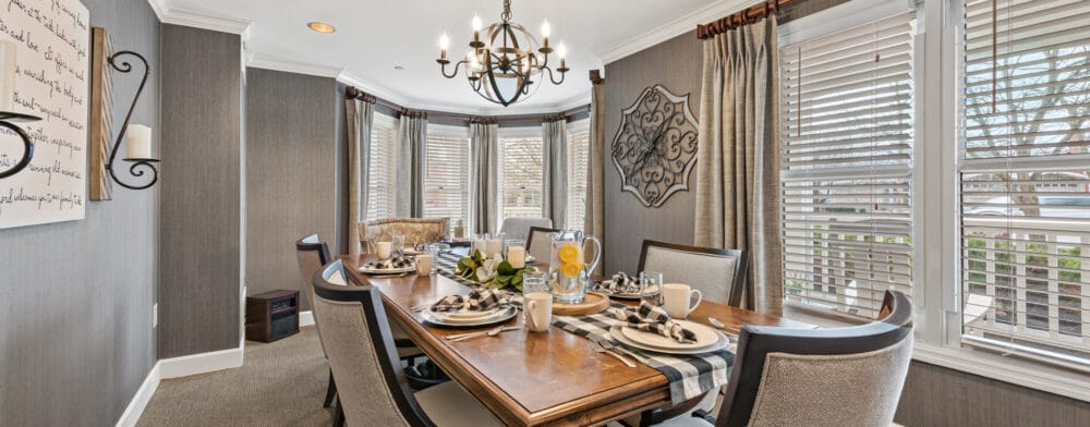 Tastefully set dining room table with natural light