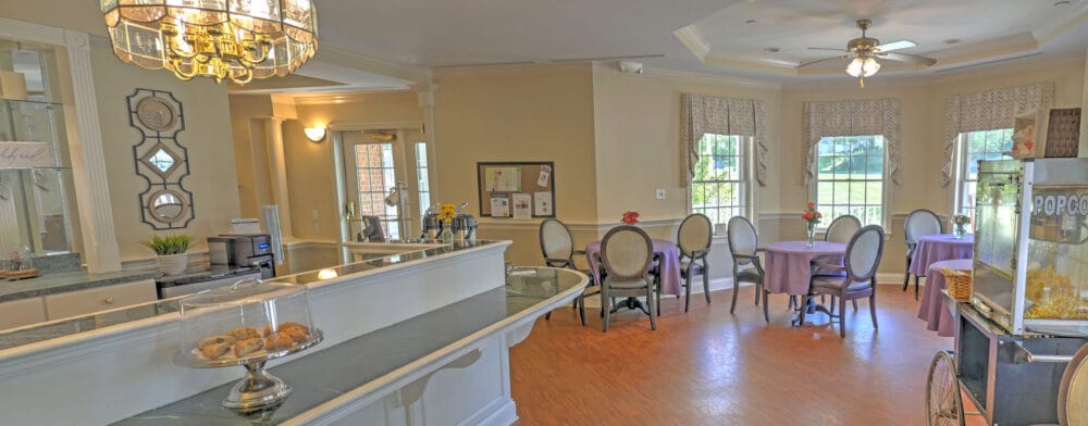 Bright dining area with tables and snacks visible