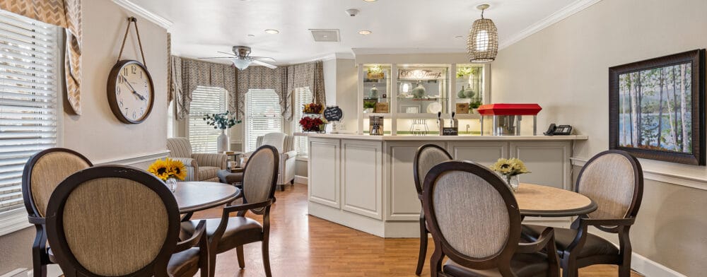 Bright common area with dining tables and decor