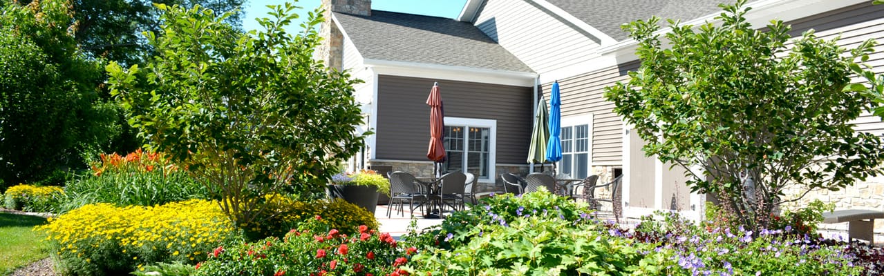 Beautiful outdoor patio area with flowers and seating