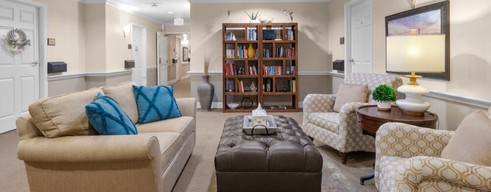 Cozy common area with seating and bookshelves