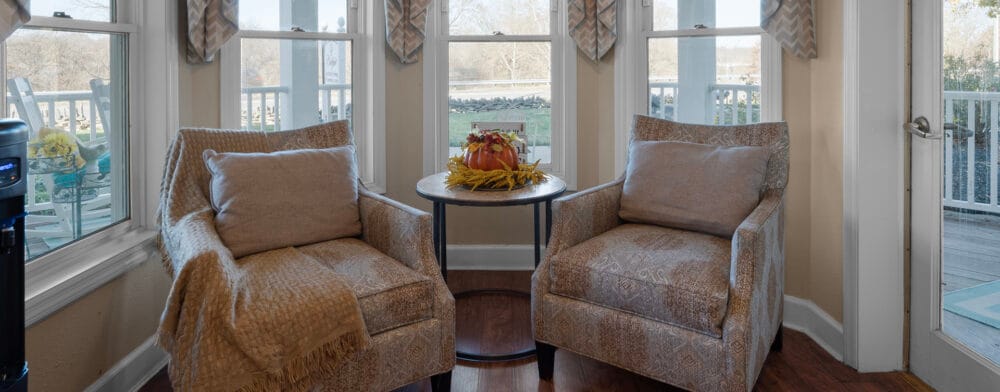 Cozy seating area with two armchairs and a small table