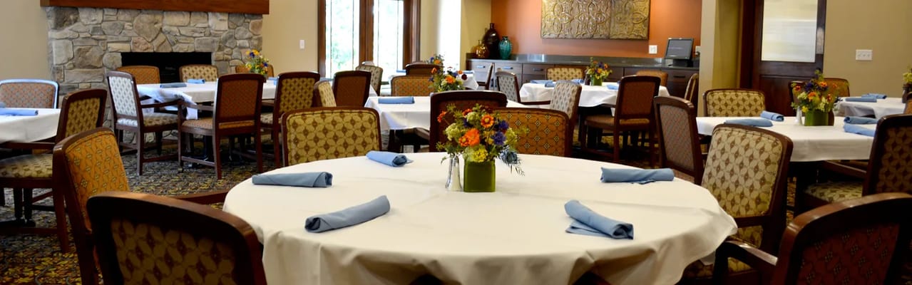 Dining room setup with flowers on tables