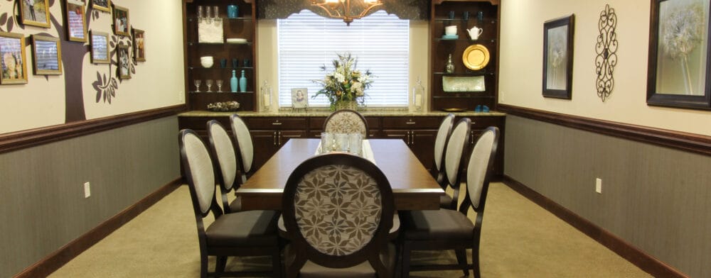 Interior dining area with a large table and decor