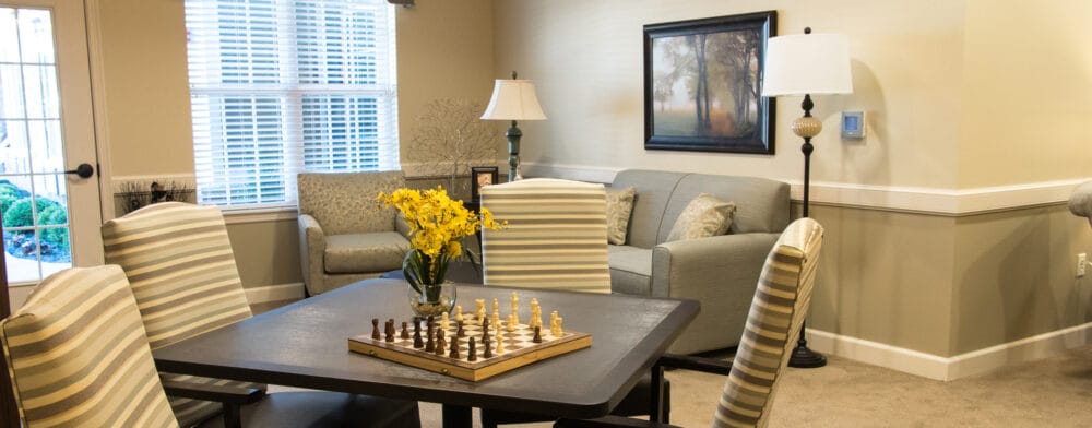 Comfortable common area with seating and a chess set