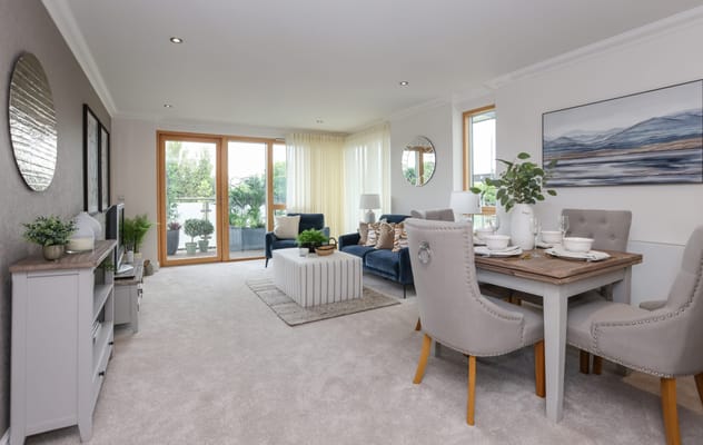 Bright and modern common area with seating and dining table