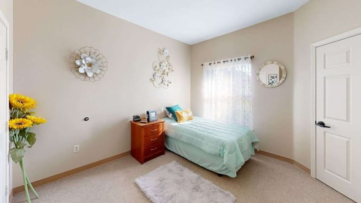 Bright and cozy private resident room with floral decor