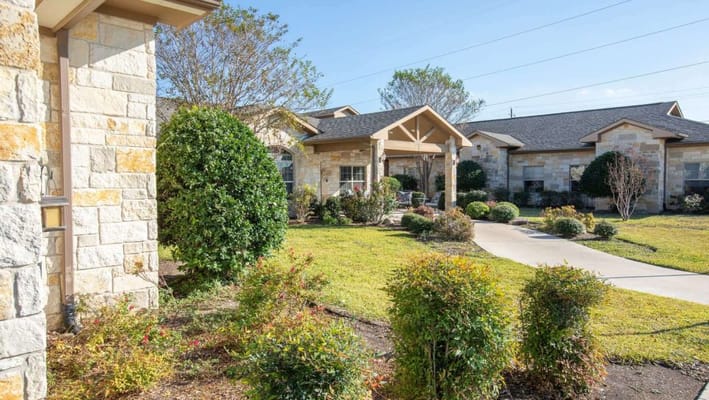 Exterior view of landscaped outdoor space in the facility.