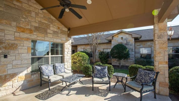 Seating area with chairs and plants in a garden