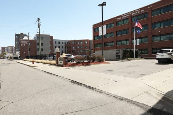 Exterior view of Rivertown Assisted Living Apartments with the address visible.