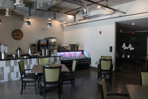 Interior dining space with tables and chairs