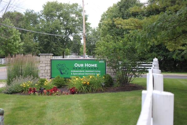 Sign for Our Home - New Albany, highlighting independent and assisted living services.
