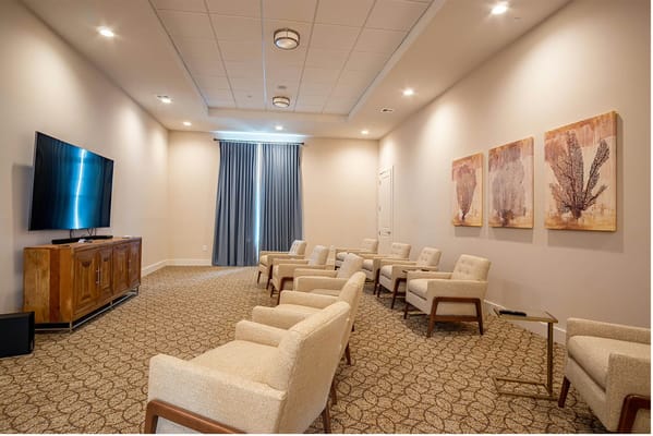 Common area with seating and a TV set-up