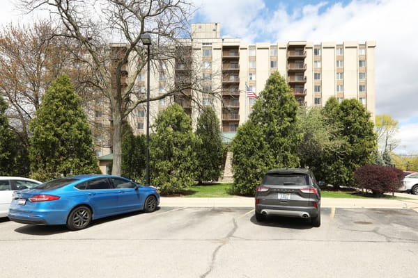 Exterior view of Maple Heights Senior Living with cars in parking lot