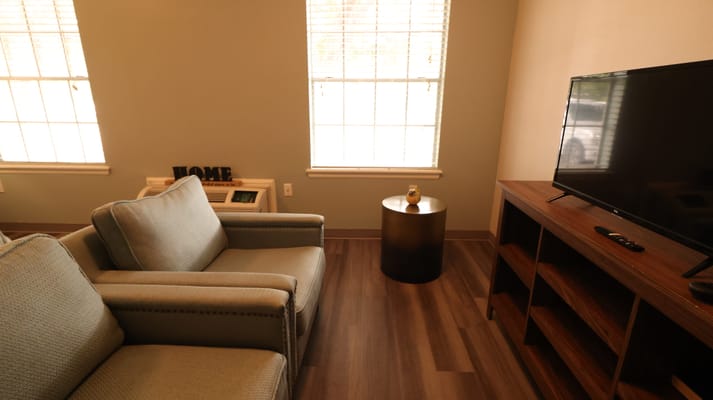 Living room area with comfortable seating and television