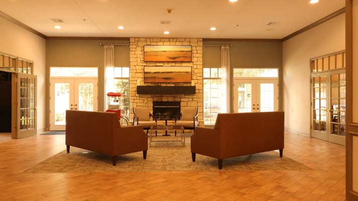 Cozy lobby with seating and a fireplace