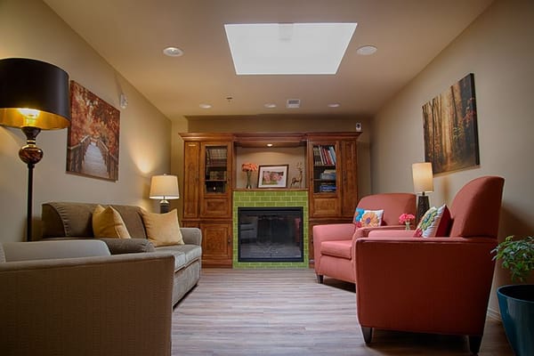 Cozy common area with seating and bookshelves