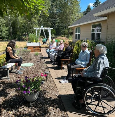 Residents enjoying an outdoor activity in the garden