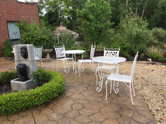 Outdoor seating area with tables and plants