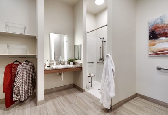 Bright and clean resident bathroom with shower