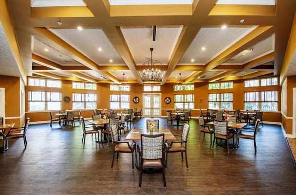 Bright dining room with tables and chairs