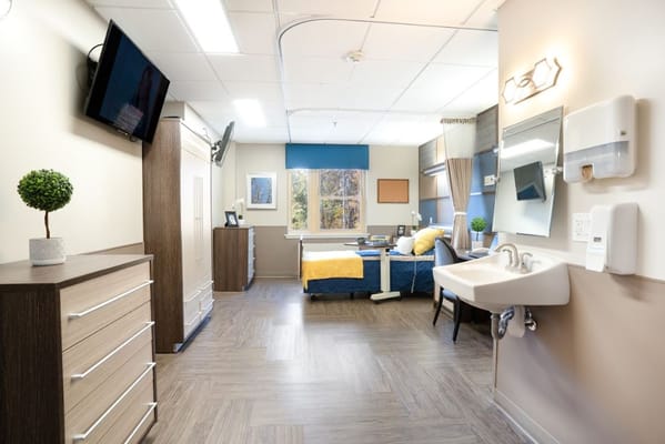 Bright private room with bed and furniture