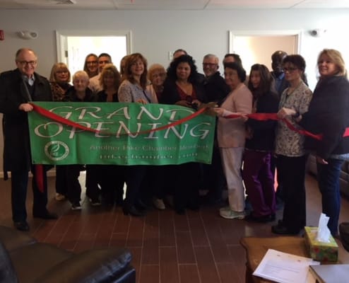 Residents and staff celebrating a grand opening event